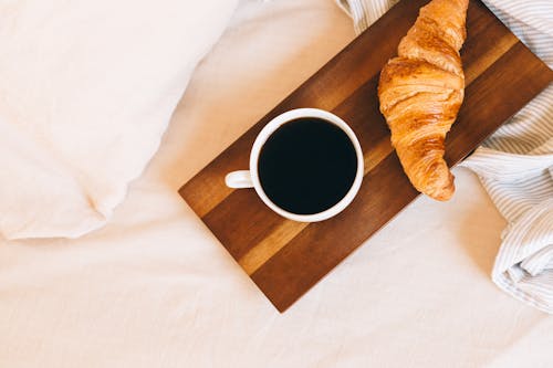 Croissant on Brown Wooden Tray