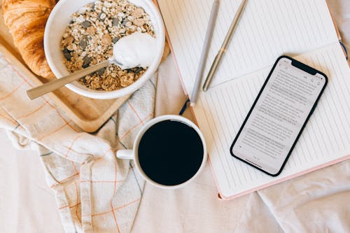 Breakfast with Smartphone in Bed