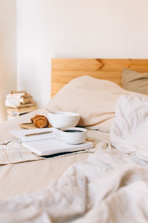 White Notebook on the Bed · Free Stock Photo