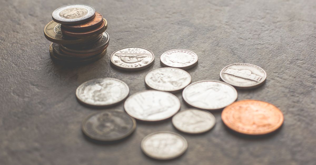 Assorted Silver and gold colored Coins On Gray Surface Free Stock Photo Assorted Silver and gold colored Coins On Gray Surface Free Stock Photo