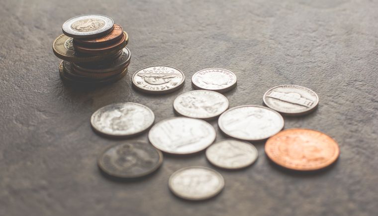 Stack of coins on slate, photo by Steve A Johnson on Pexels