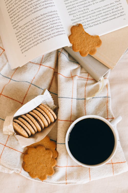 Free Biscuits Next to a Cup of Coffee  Stock Photo