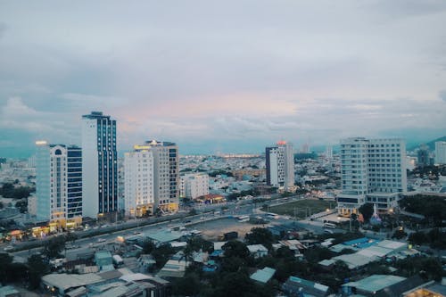 Free White and Gray Concrete High-rise Buildings at Daytime Stock Photo