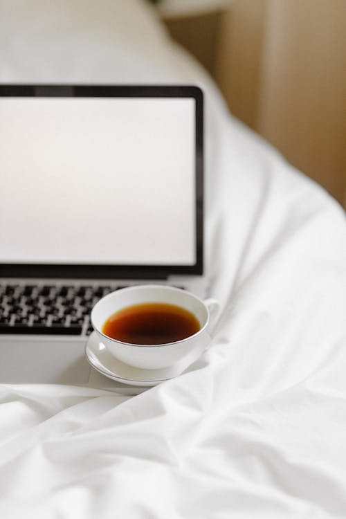 Free A Cup of Coffee on the Laptop Stock Photo