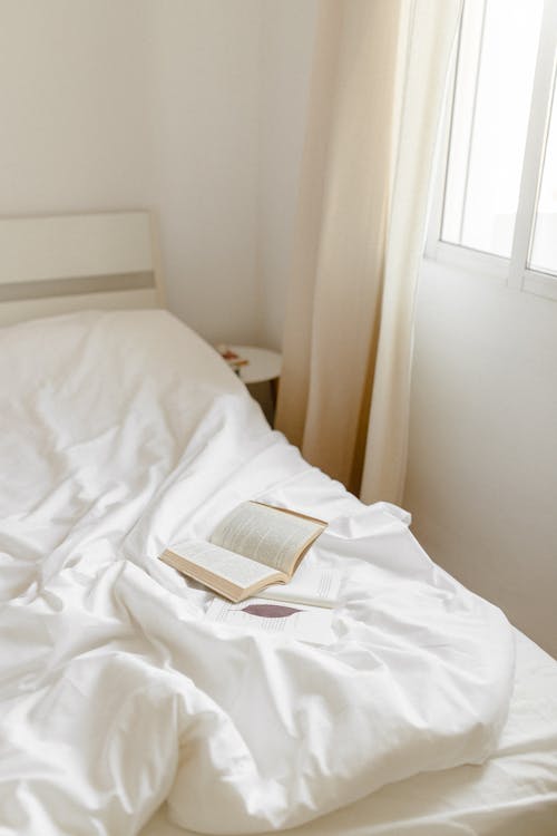 Free White Book on White Bed Stock Photo