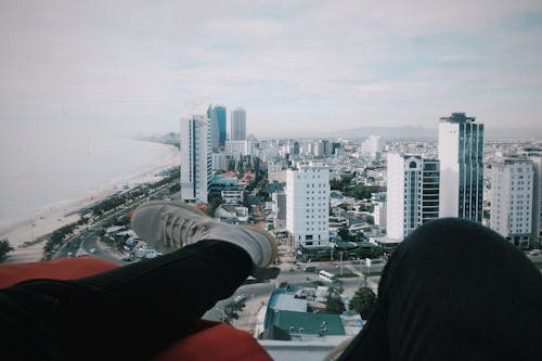 Person Wearing Black Jeans and White Sneakers