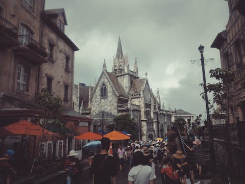 Photography of People Walking on Street Near Buildings