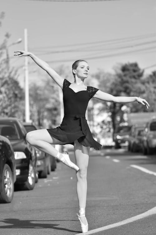 Free A Woman Doing Ballet Dance on the Road Stock Photo
