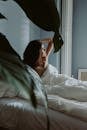 A Woman Waking Up on a Bedroom