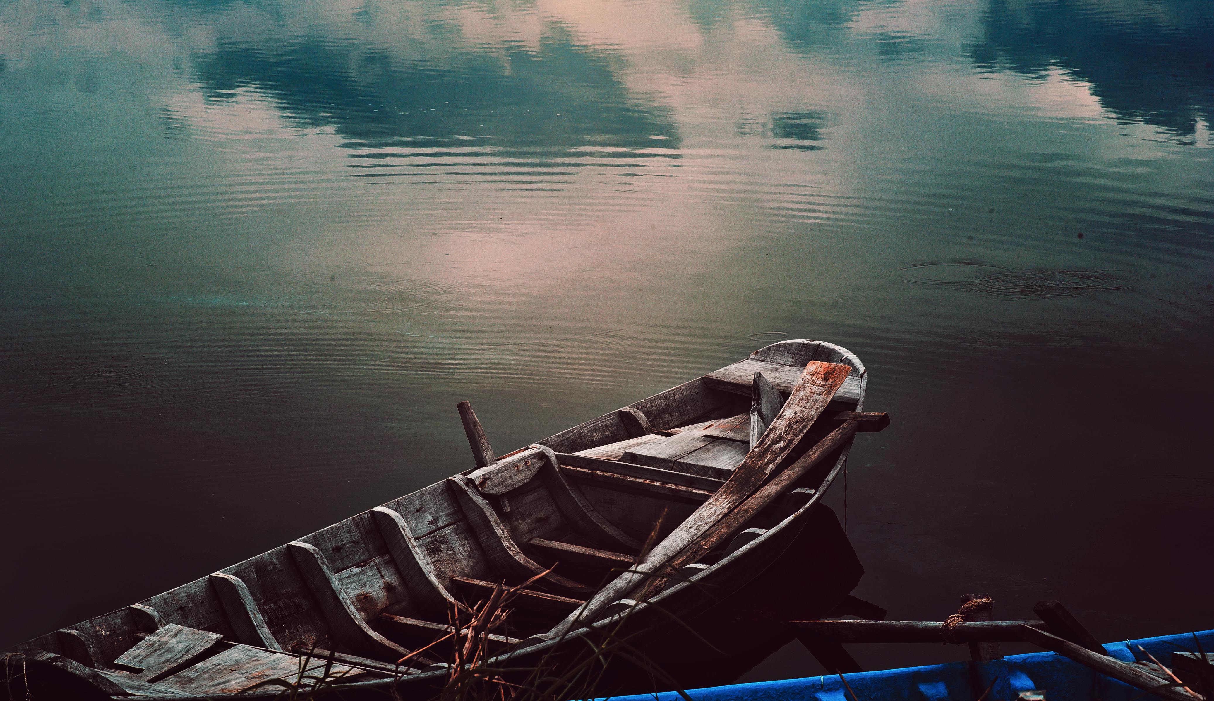 Three People on Brown Canoe Sailing on Calm Water · Free ...