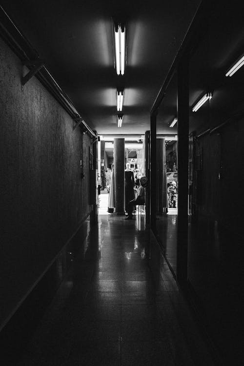 Grayscale Photo of a Hallway