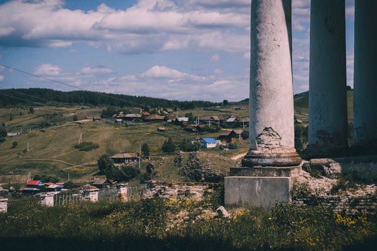 Ruins Of Ancient Columns Overlooking Valley