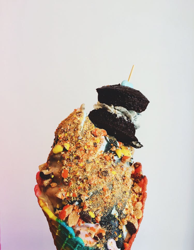 Ice Cream On Cone With Crushed Peanuts And Brownies