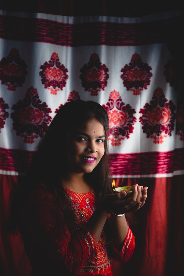 Indian Woman Holding Lit Candle