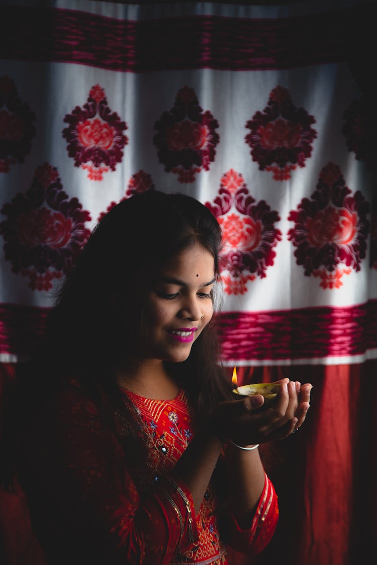 Brunette Woman Holding Candle