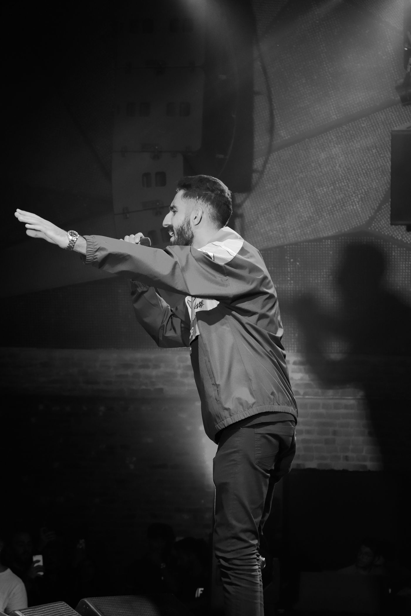Comedian engaging an audience during a live stand-up show