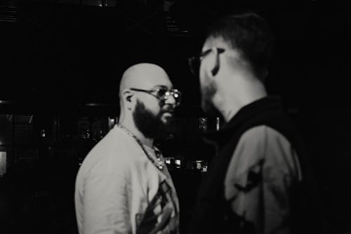 Two Bearded Men Talking 