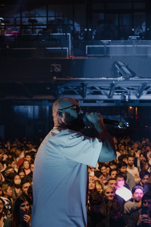 Man in White Shirt Singing