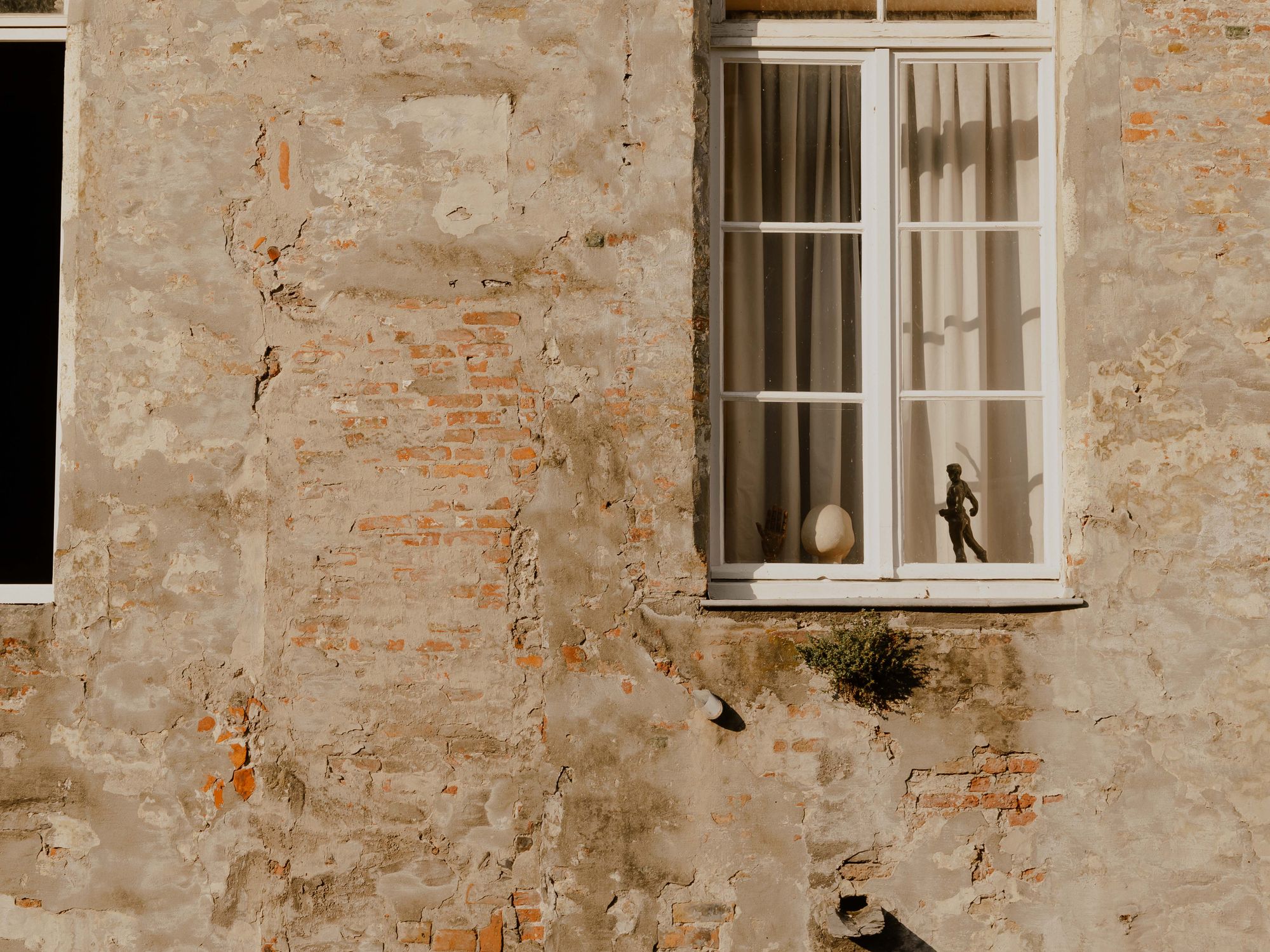 Exterior Painting in Preston, Brent — painter refreshing a house exterior in weatherproof paint
