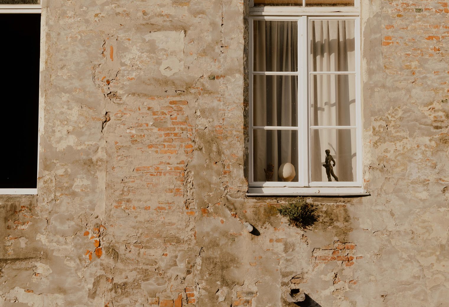 Exterior Painting in Crayford — a decorator at work mid-project