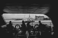 Grayscale Photo of People Riding Bicycle
