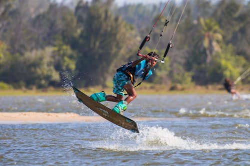 Free A Boy Wakeboarding at the Beach Stock Photo