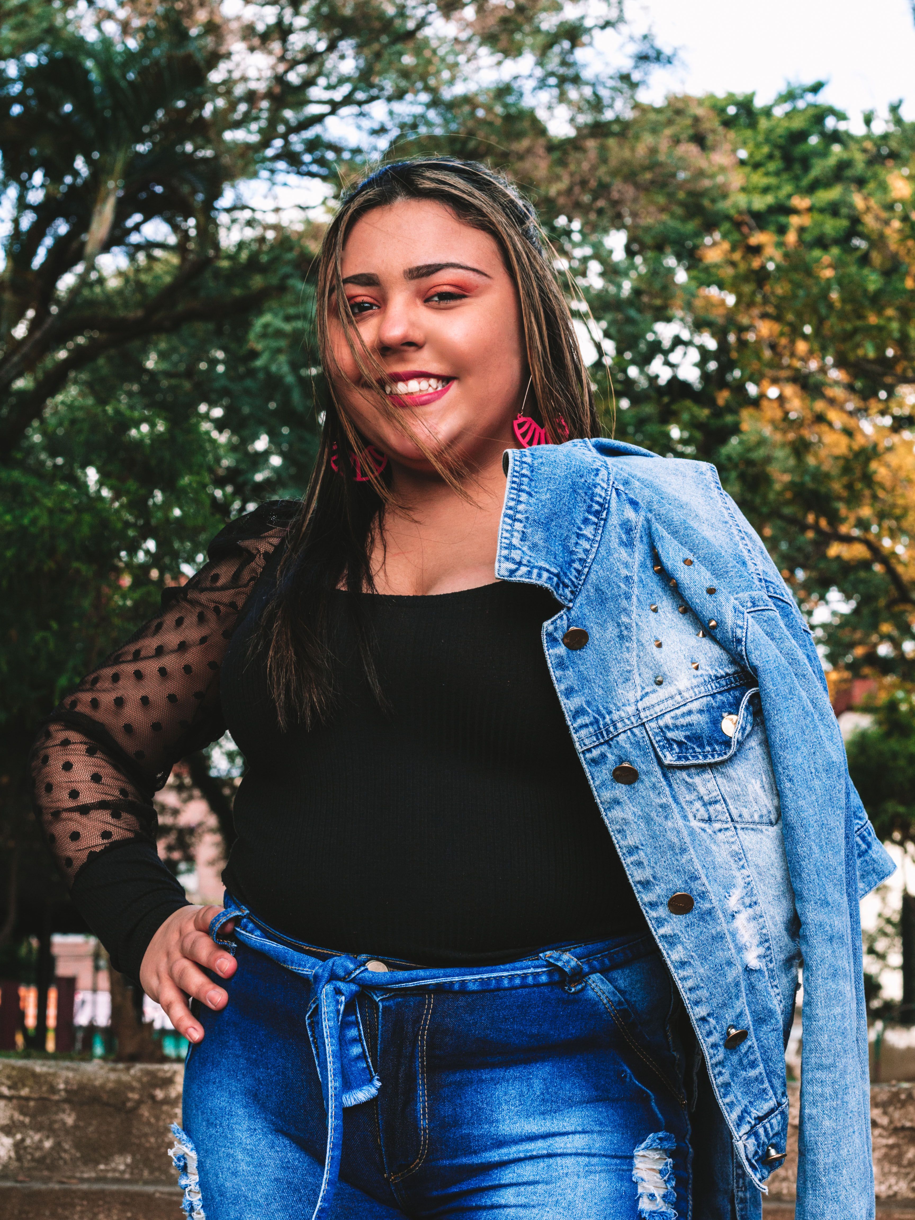 A Woman in Black Blouse and Blue Denim Jacket · Free Stock Photo