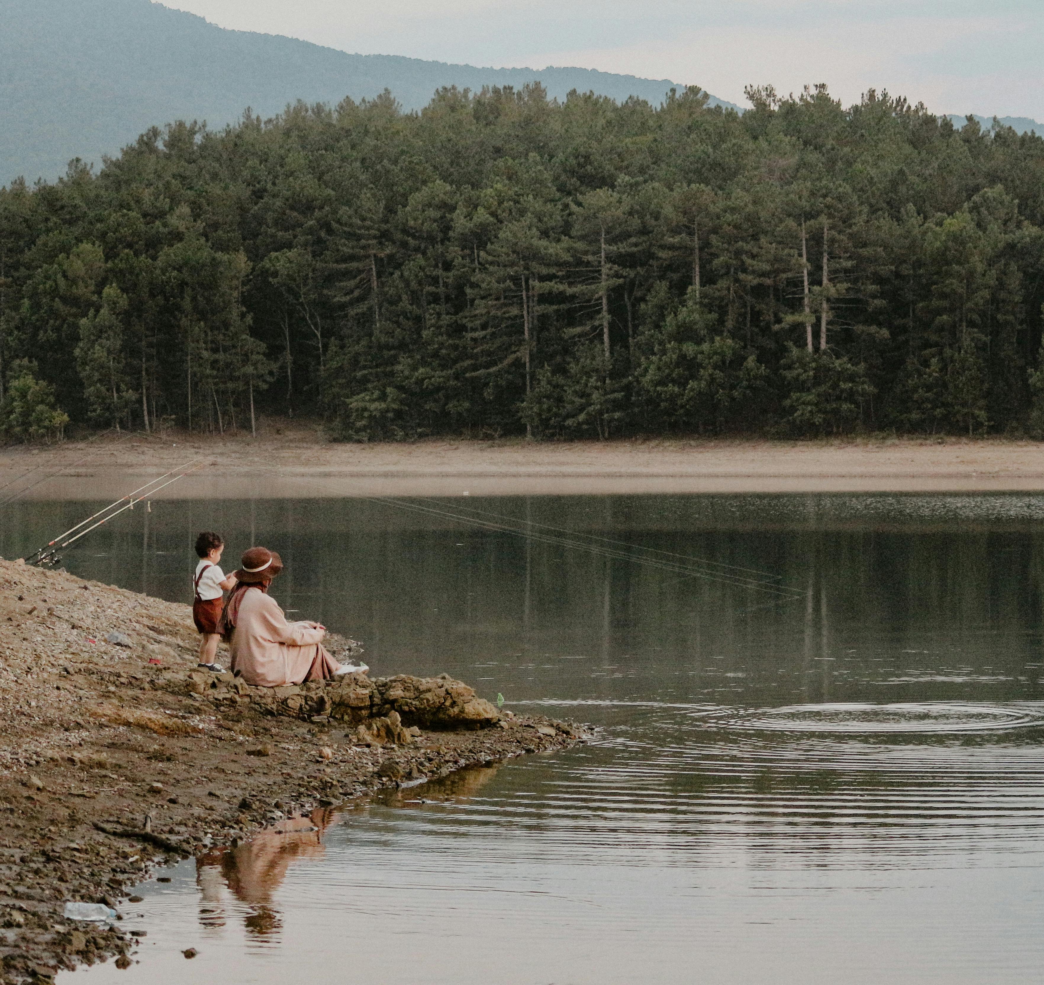Family enjoying a peaceful fishing trip - family fishing trips
