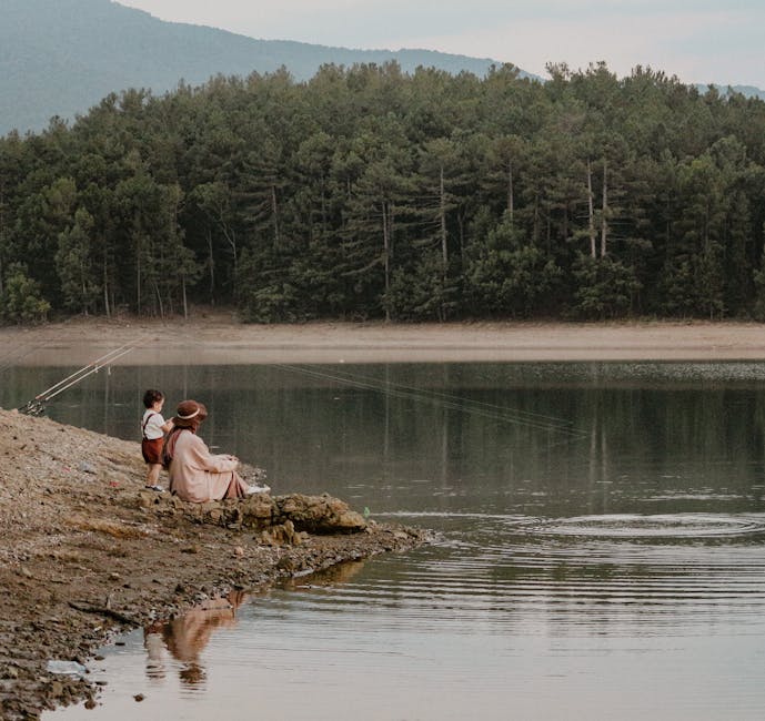 Family enjoying a peaceful fishing trip - family fishing trips Family enjoying a peaceful fishing trip - family fishing trips