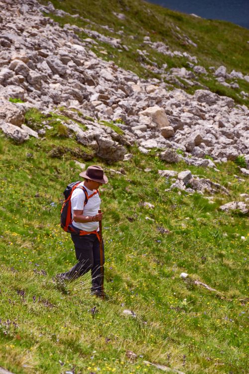 Free A man hiking through rocky terrain with a backpack, showcasing outdoor adventure and exploration. Stock Photo