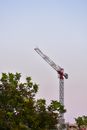 Red Metal Crane Near Green Tree