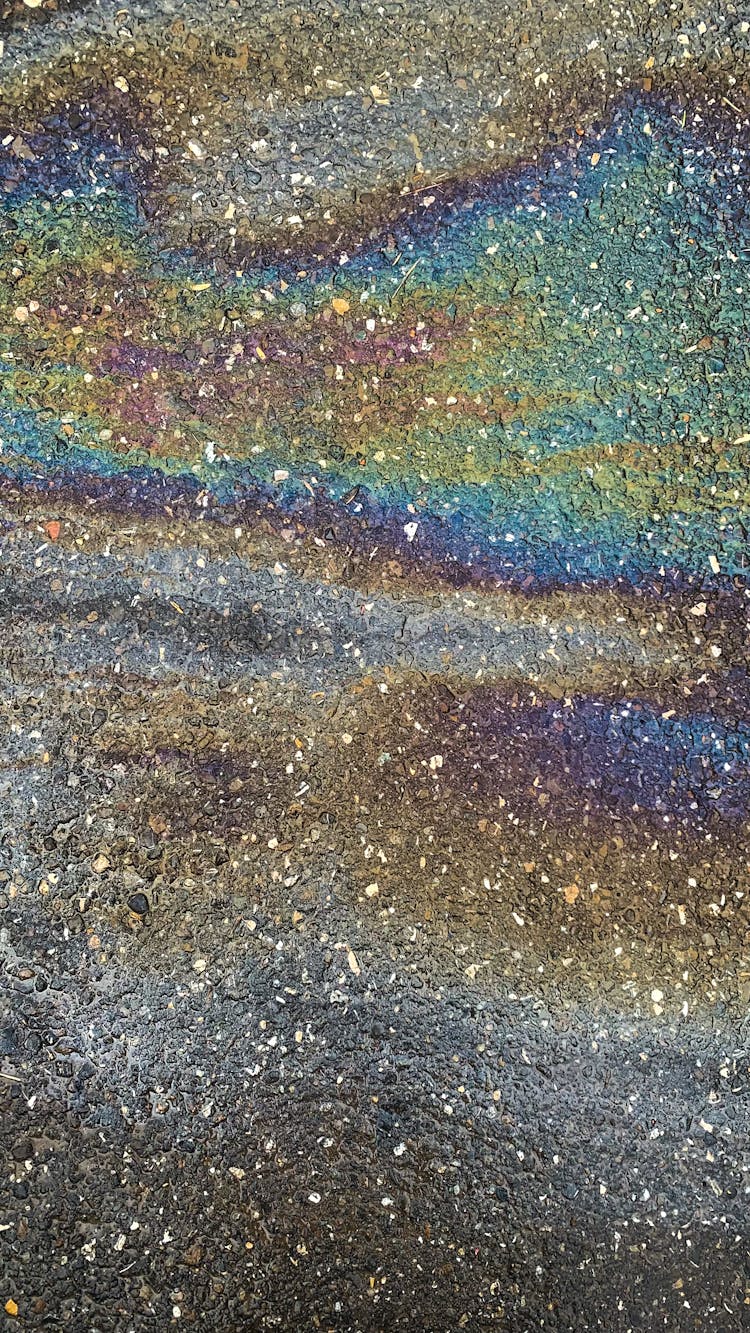 Colorful Oil Stains On Pavement