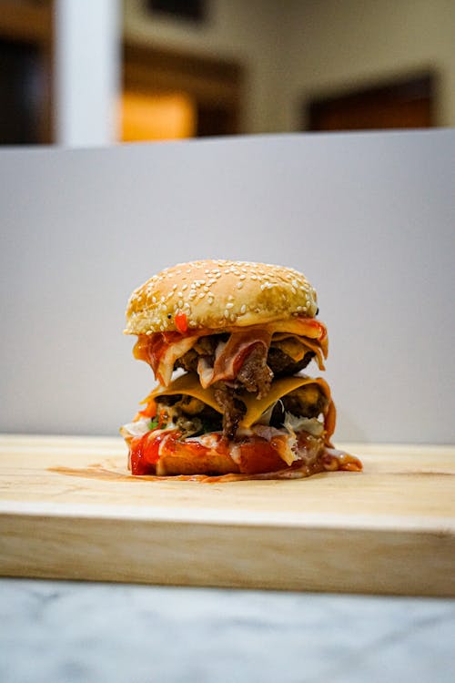 A Delicious Double Patty Cheese Burger with Ketchup · Free Stock Photo