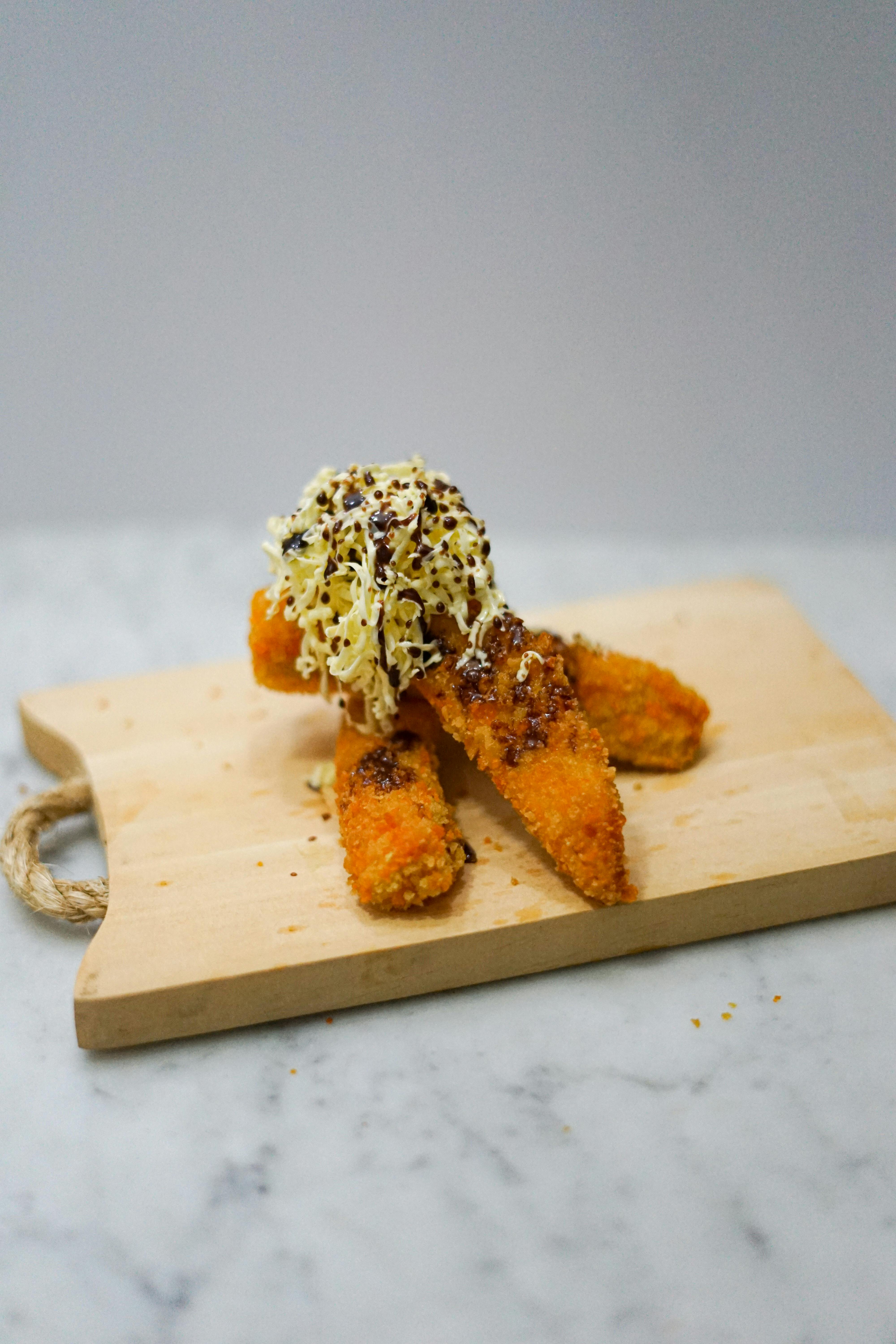 Breaded Chicken with Grated Cheese and a Splash of Choco Syrup · Free