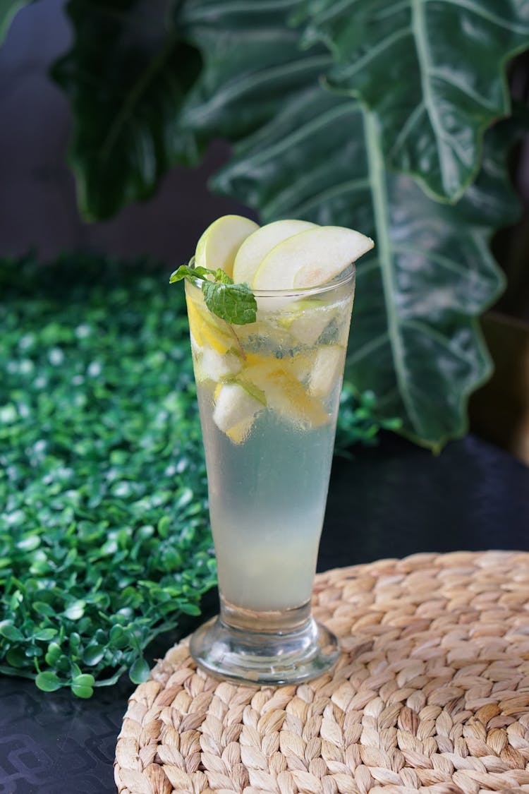 Lemonade In Tall Glass With Slices Of Apple On Top