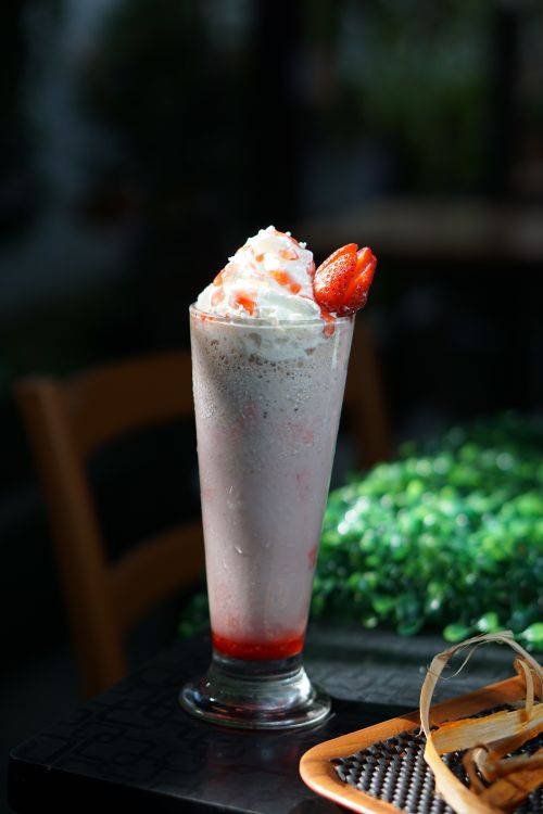 Pink strawberry drink in a tall glass — photo by Arief Setiawan on Pexels