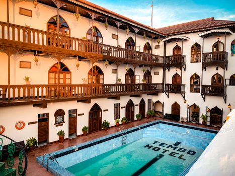 Beautiful Tembo Hotel courtyard with a swimming pool in Zanzibar, Tanzania.