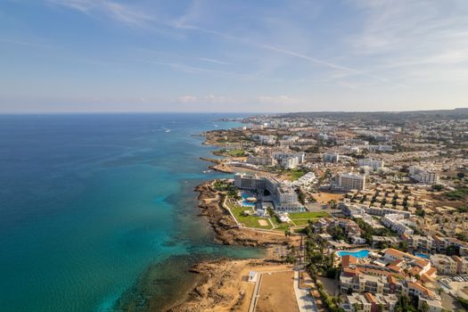 Stunning aerial view of Protaras coastline showcasing resorts, beaches, and crystal-clear waters in Cyprus.