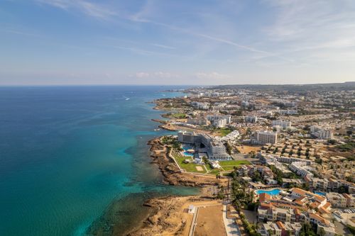 Free Stunning aerial view of Protaras coastline showcasing resorts, beaches, and crystal-clear waters in Cyprus. Stock Photo