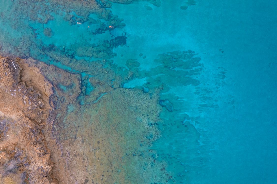 See Rocks Through Water Aerial View of Rock Formation Under the Water · Free Stock Photo