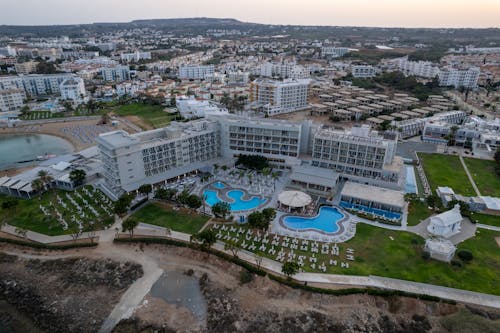 Aerial View of City Buildings Behind a Luxurious Hotel