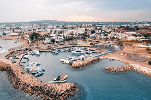 Free Aerial view of Pernera Marina in Famagusta, Cyprus showcasing boats and coastal scenery. Stock Photo