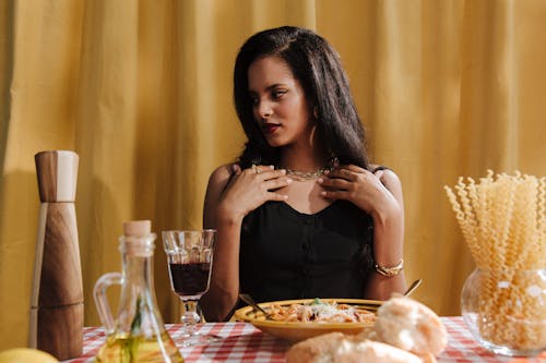 Free Portrait of Woman Sitting at Table With Food Stock Photo