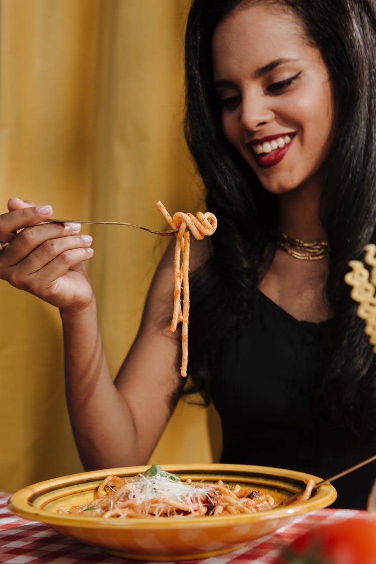 Smiling Woman Eating Spaghetti Bolognese