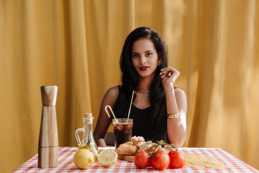 A stylish woman dining with Italian ingredients, exuding elegance and sophistication.