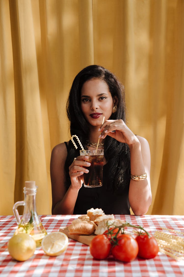 Woman Holding Glass With Carbonated Drink