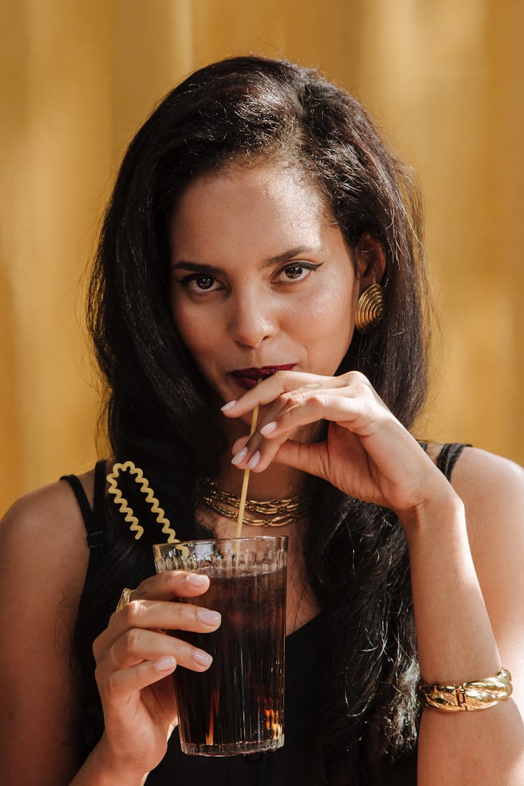 Portrait Of Woman Drinking Cola