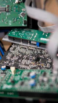 Vertical shot of stacked circuit boards showcasing intricate electronic design and components.