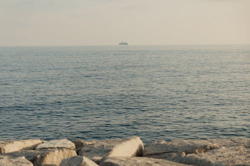 Beautiful Landscape Photo of a Ship over Sea Horizon 