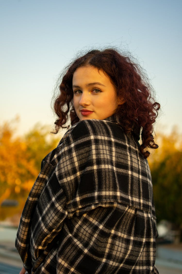 Beautiful Curly Girl Posing In Nature On Sunset 